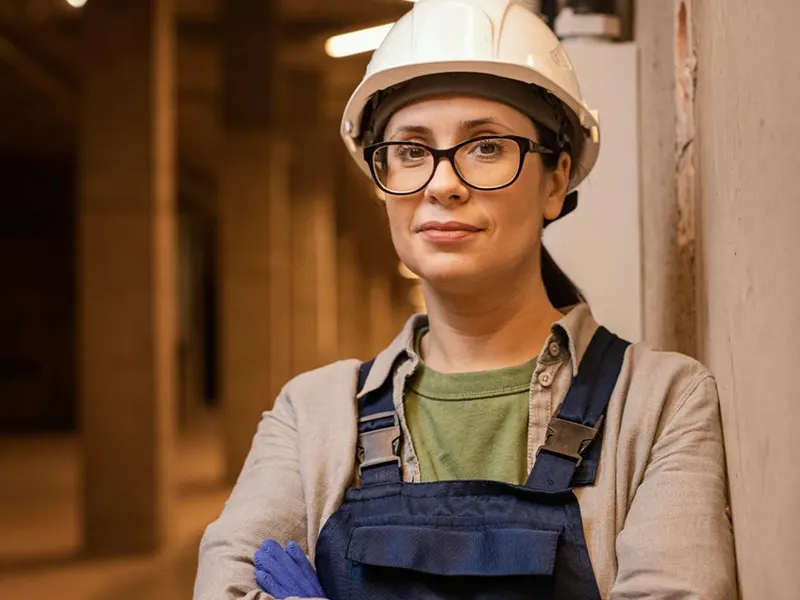 Beachland Construction: A Woman Contractor Leaning Up Against the Wall